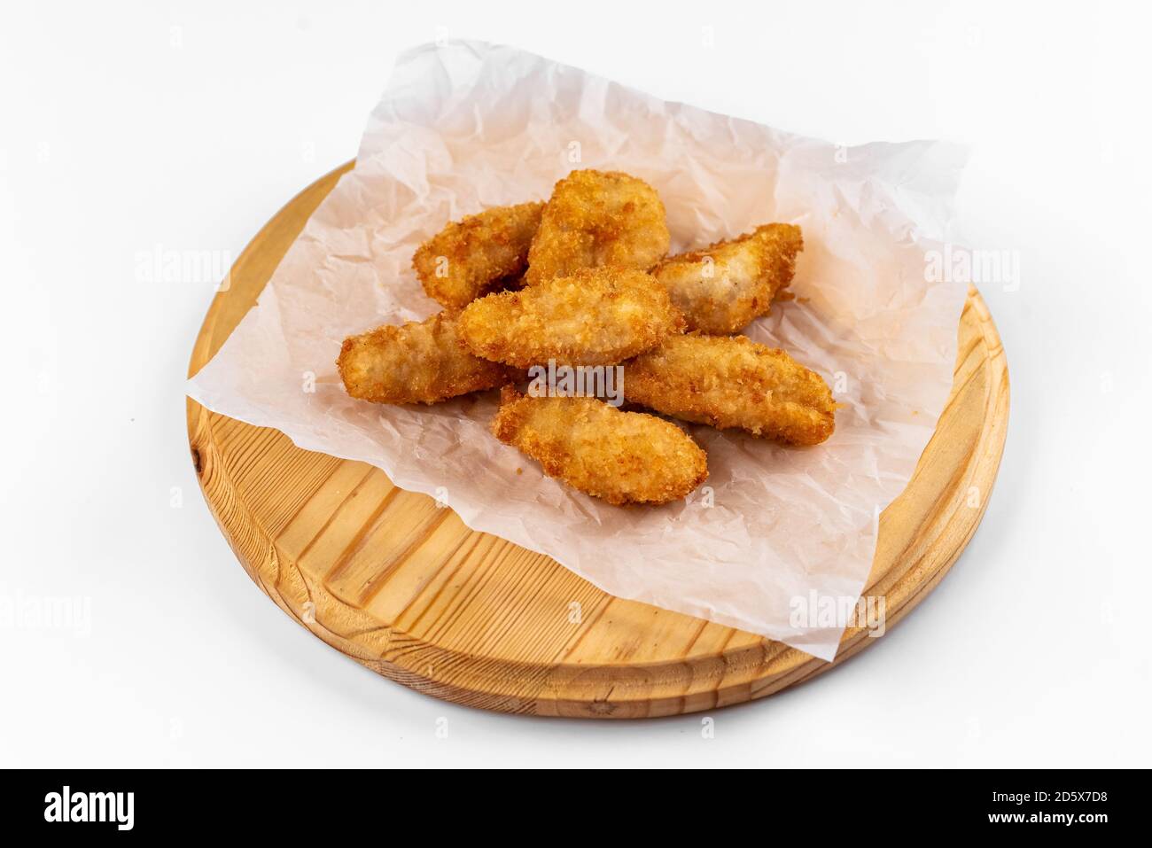 chicken wings on a wooden plate on a white background Stock Photo