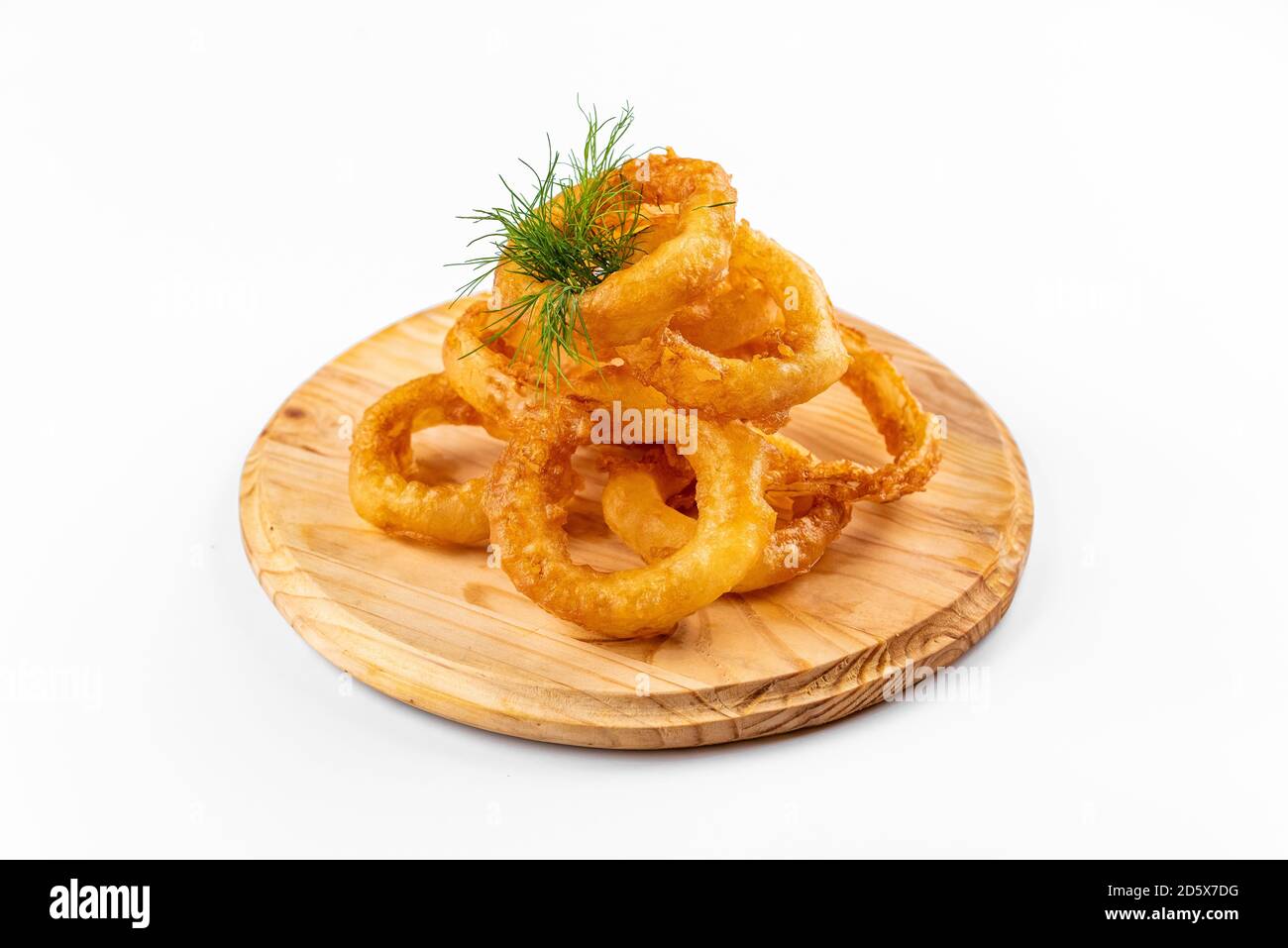 onion rings on a wooden plate on a white background Stock Photo