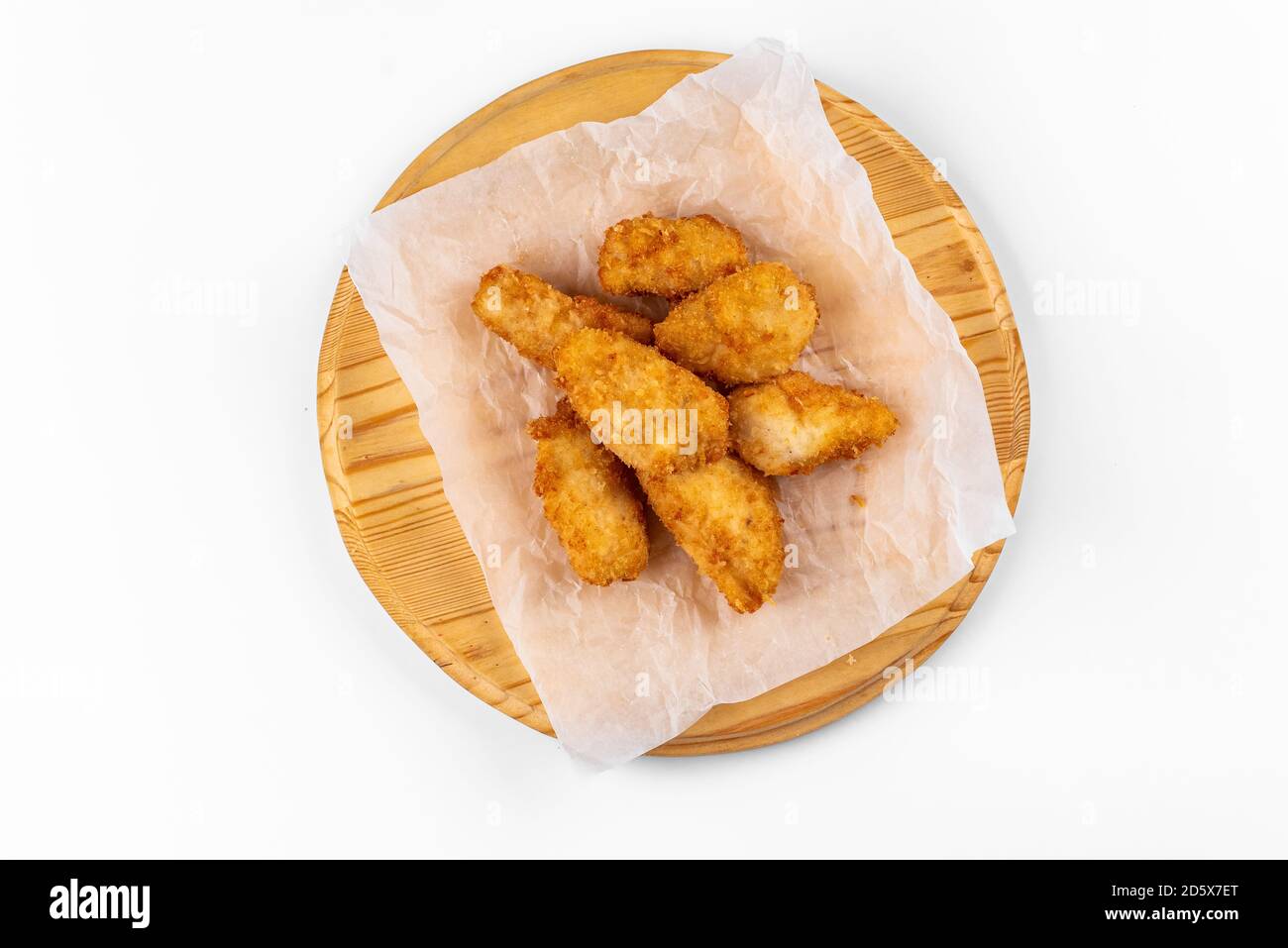 chicken wings on a wooden plate on a white background Stock Photo