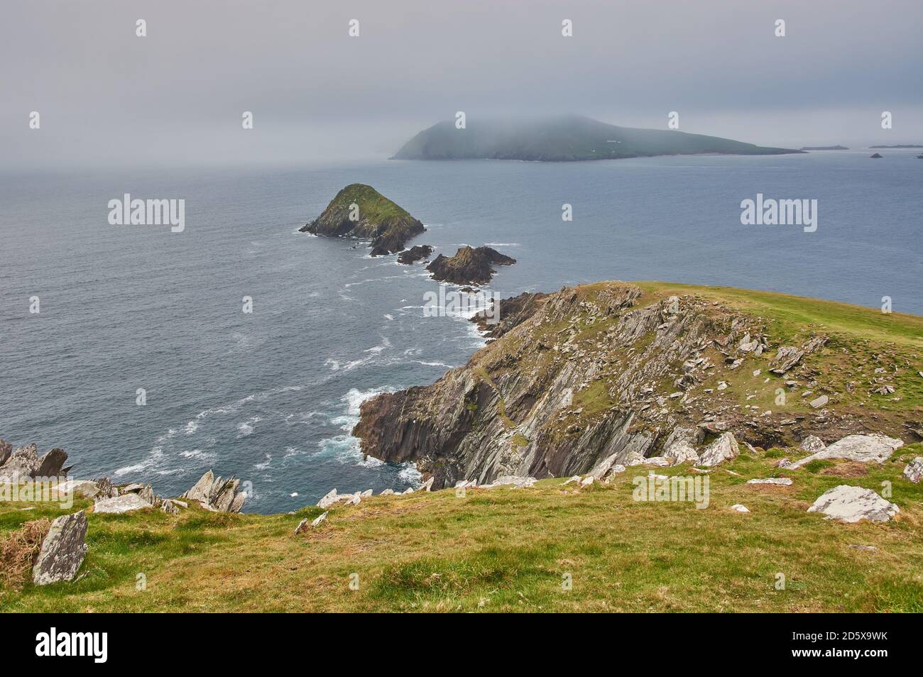 Scenic view from the dingle peninsula in Ireland. Rain clouds above the Irish coastline. Rough irish coastline with huge cliffs. Star wars movie locat Stock Photo