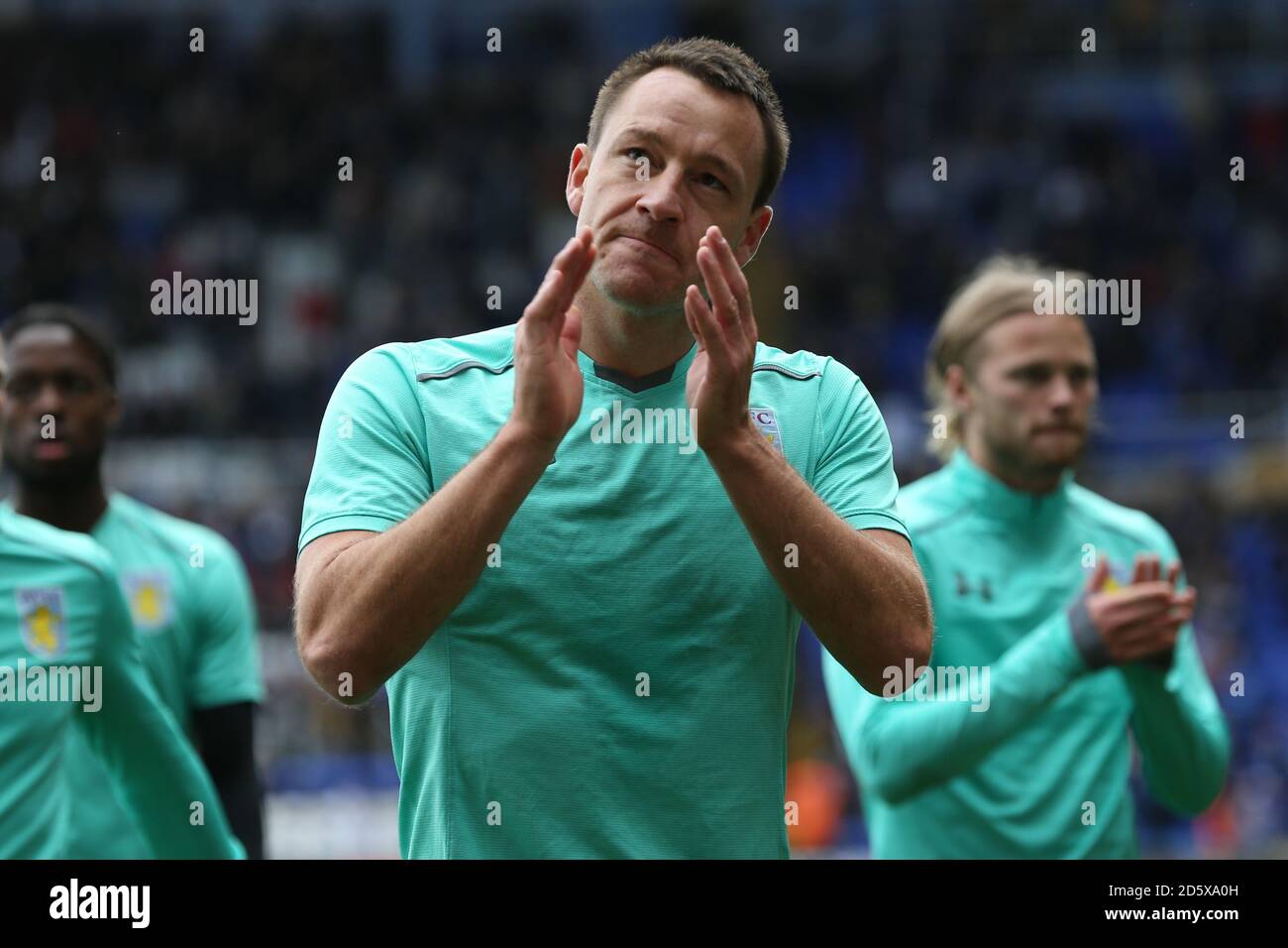 Aston Villa's John Terry claps as he walks off the pitch after warming up Stock Photo