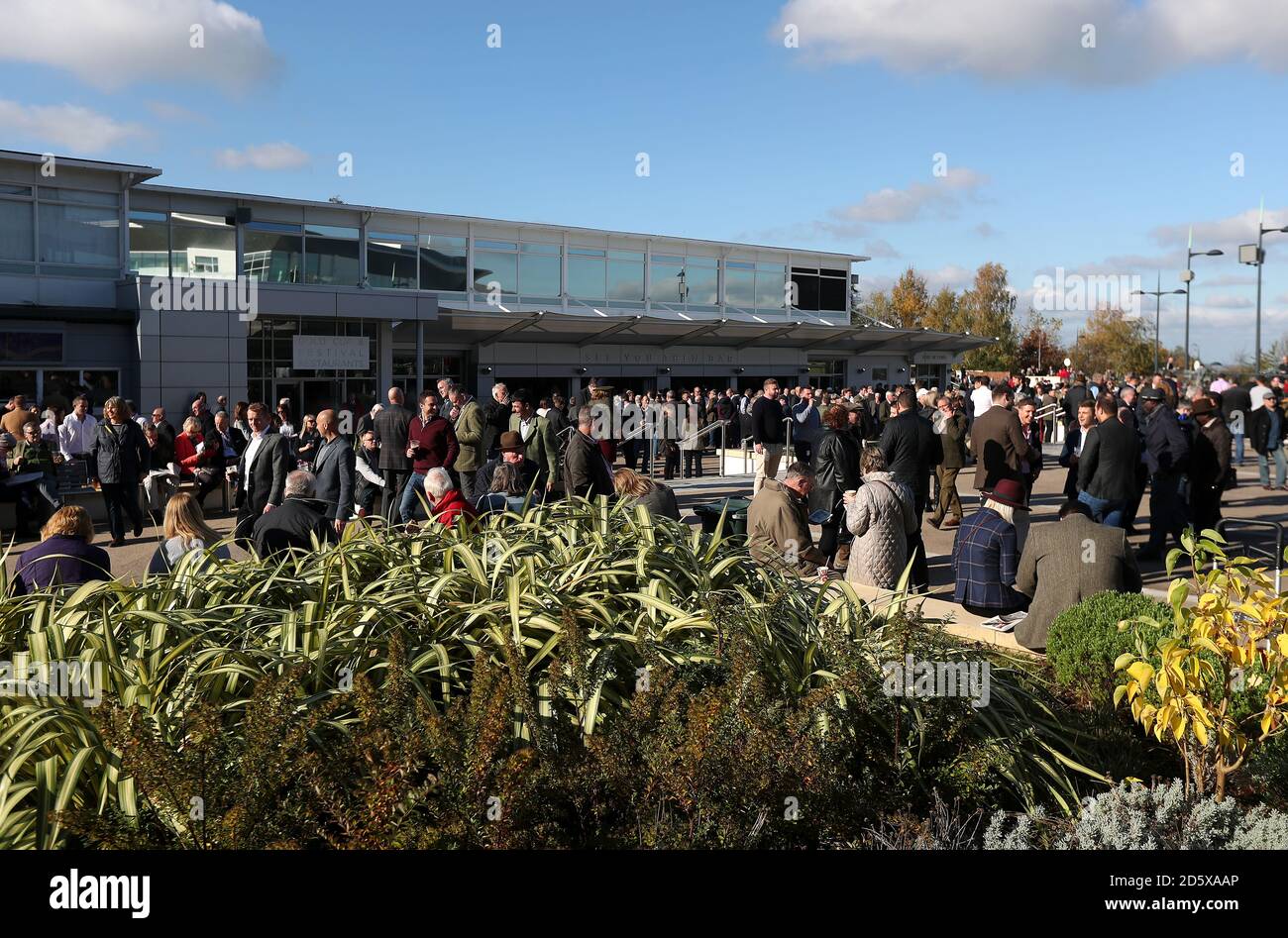 Racegoers outside the Gold Cup and Festival Restaurants during day one of the Showcase at Cheltenham Racecourse Stock Photo