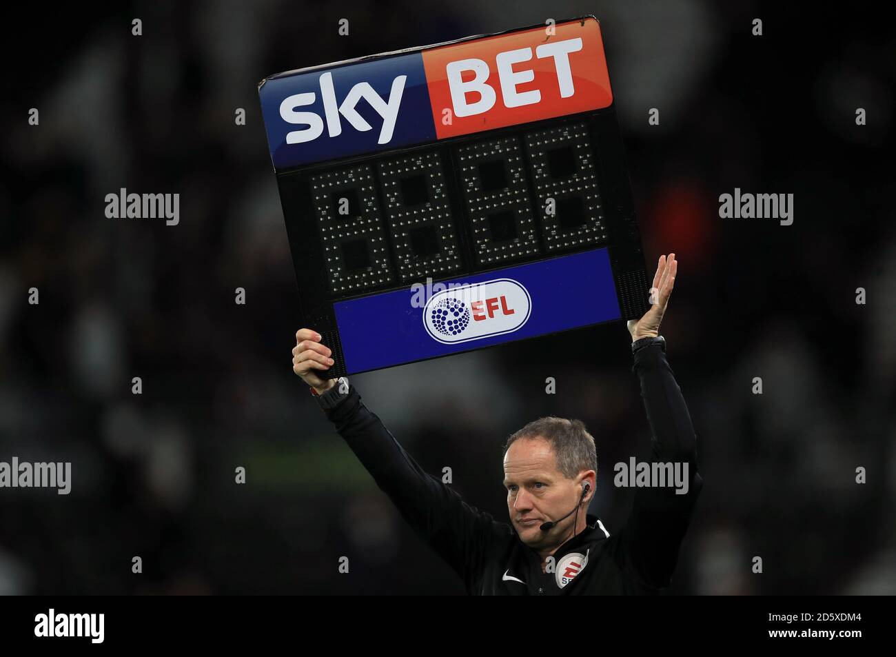 A match official holds up a sign Stock Photo Alamy