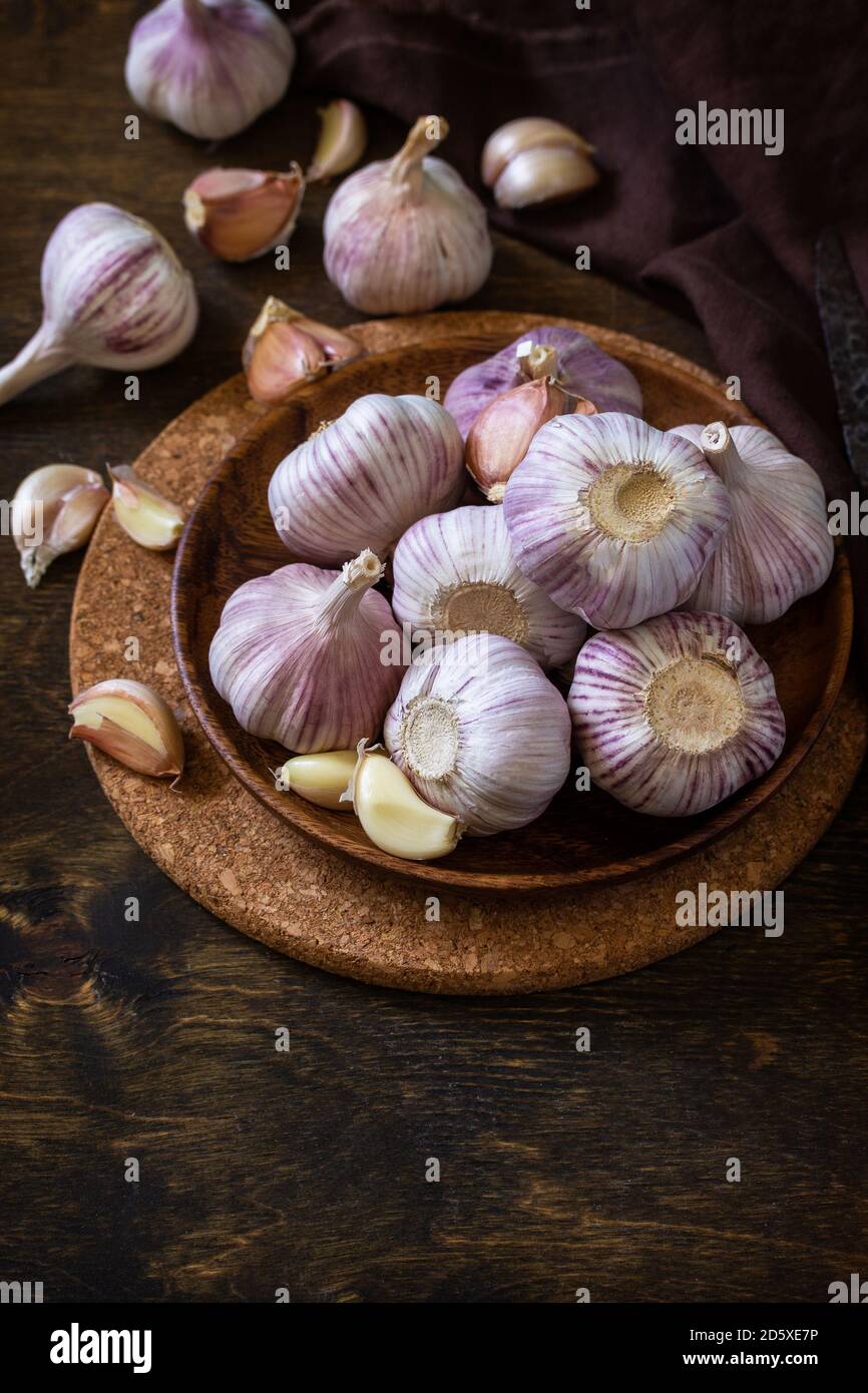 Garlic. Garlic Cloves and Bulb on rustic wooden table. Copy space Stock ...
