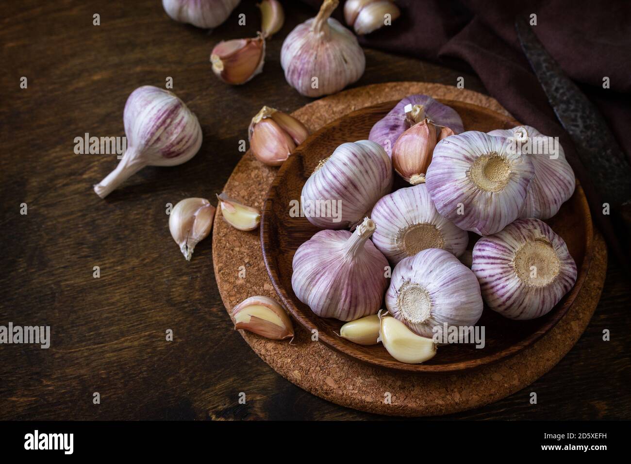 Garlic. Garlic Cloves and Bulb on rustic wooden table. Copy space Stock ...