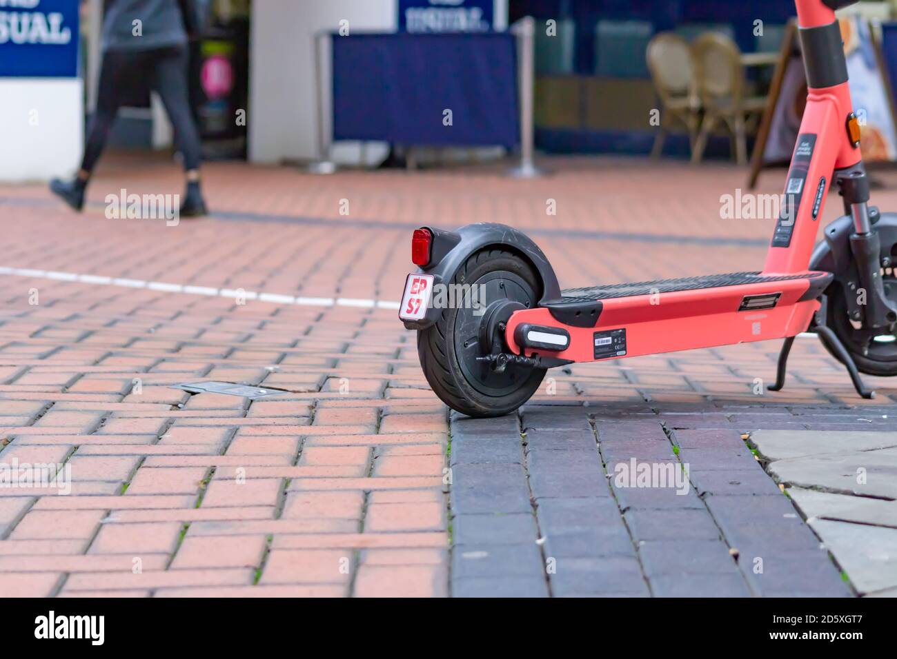 Voi electric scooters are fitted with number plates in Birmingham to improve safety and, in the words of the company, 'help [...] spot rogue riders.' Stock Photo
