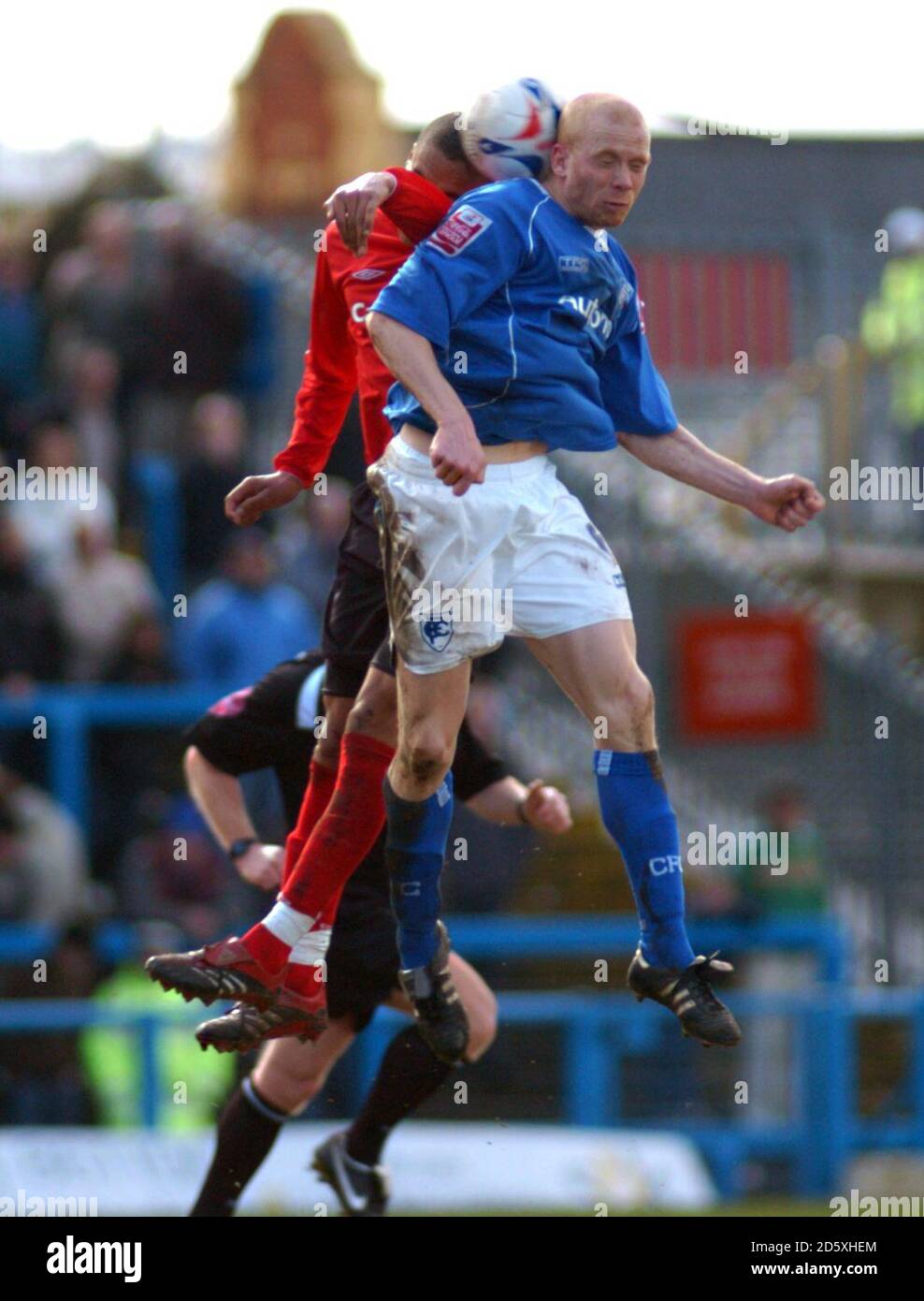 Nottingham Forest's James Perch and Chesterfield's Derek Niven jump for the ball Stock Photo
