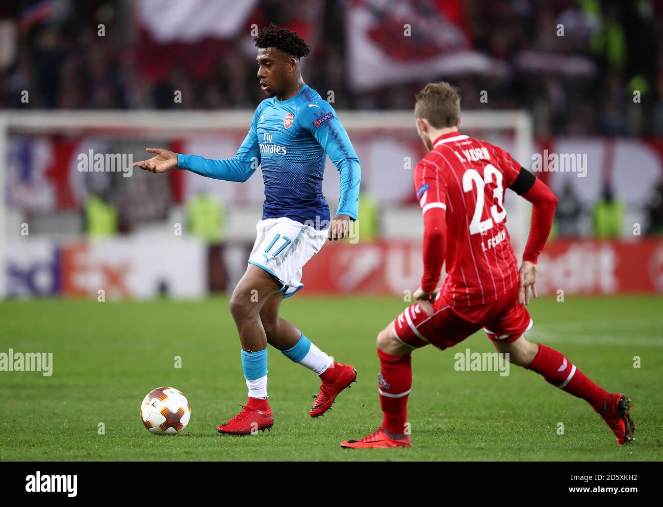 Arsenal's Alex Iwobi and Koln's Jannes Horn in action Stock Photo