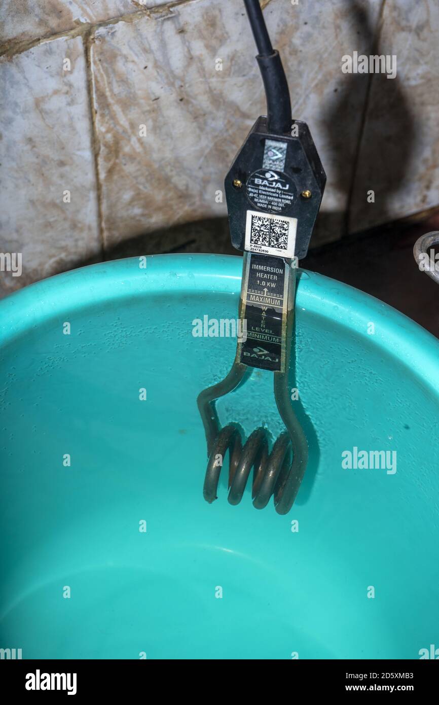 Bajaj water heater in bucket plastic Stock Photo Alamy