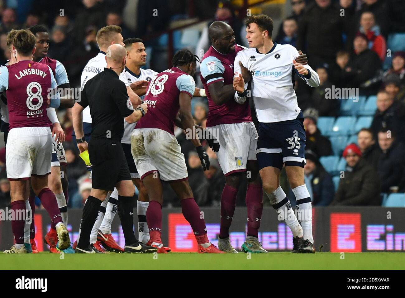 Aston Villa's Christopher Samba exchanges words with Millwall's Jake ...