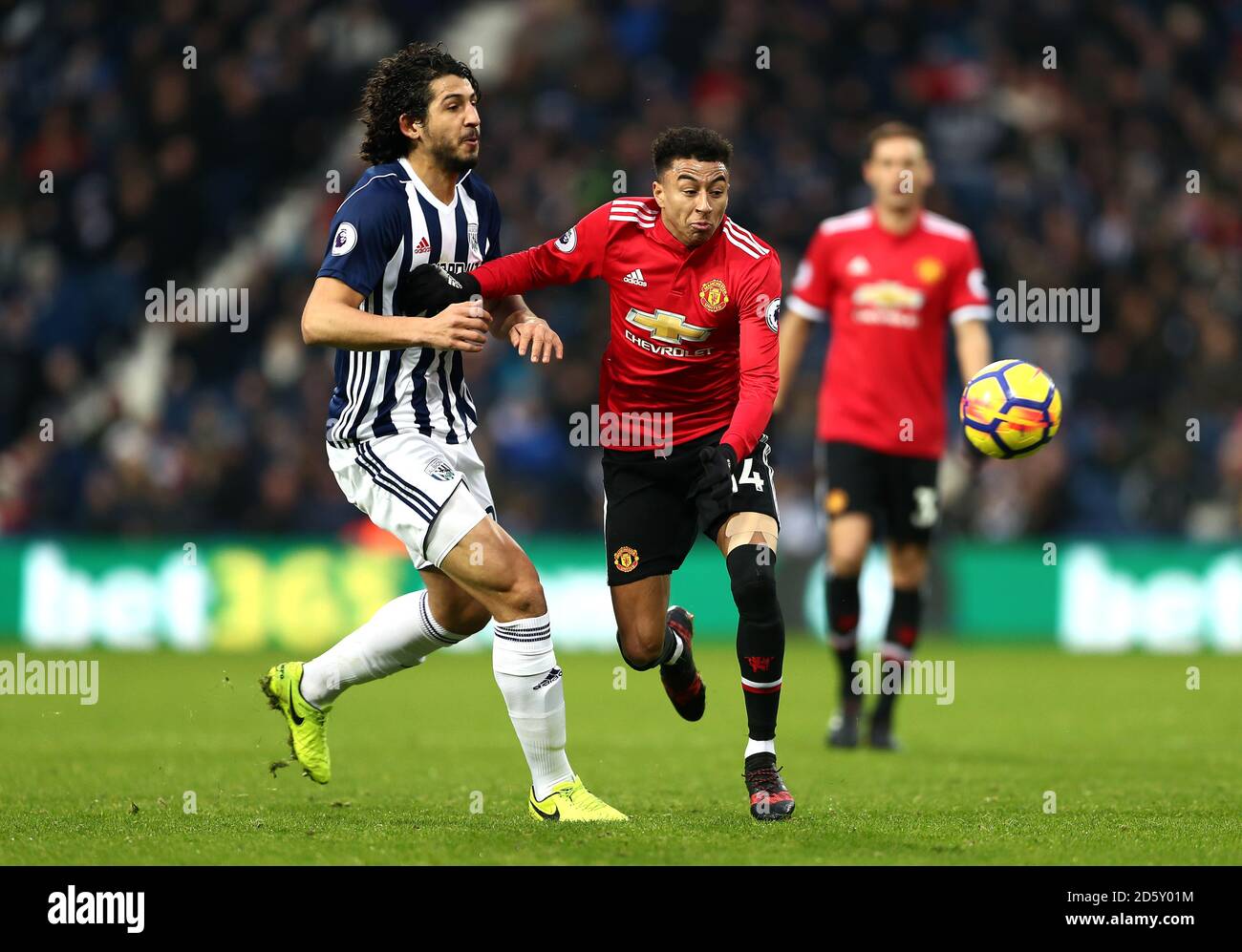 Manchester United's Jesse Lingard and West Bromwich Albion's Ahmed Hegazy battle for the ball Stock Photo