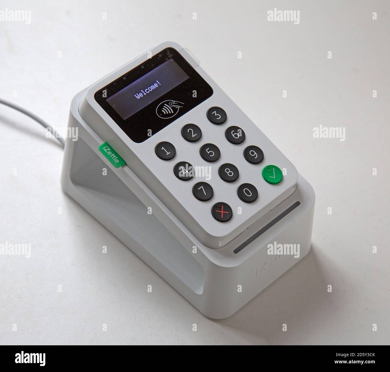 An izettle debit and credit card reader in a docking and charging pod or station. Stock Photo