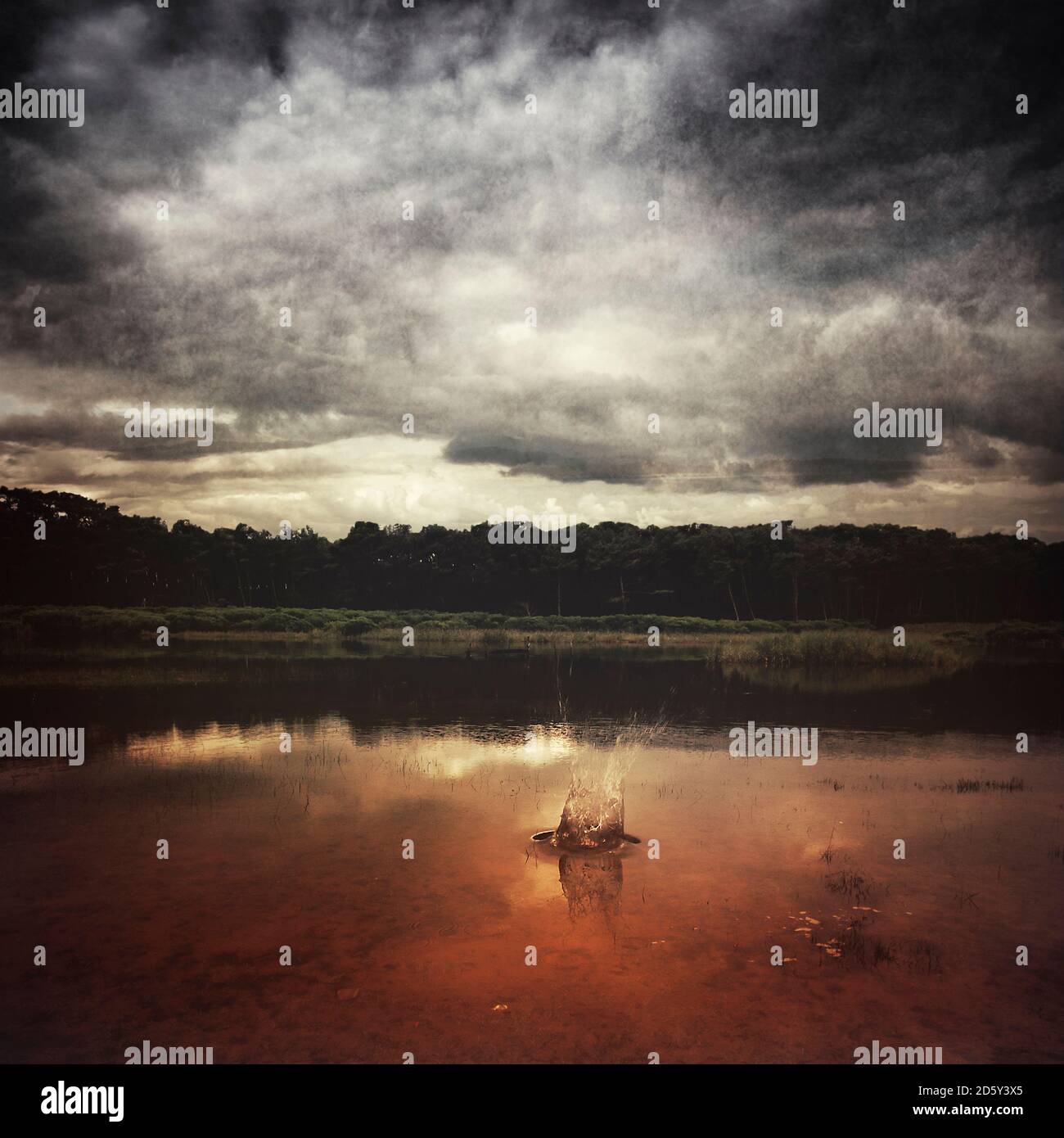 France, Contis-Plage, lake and splash of water, cloudy atmosphere, digitally manipulated Stock Photo