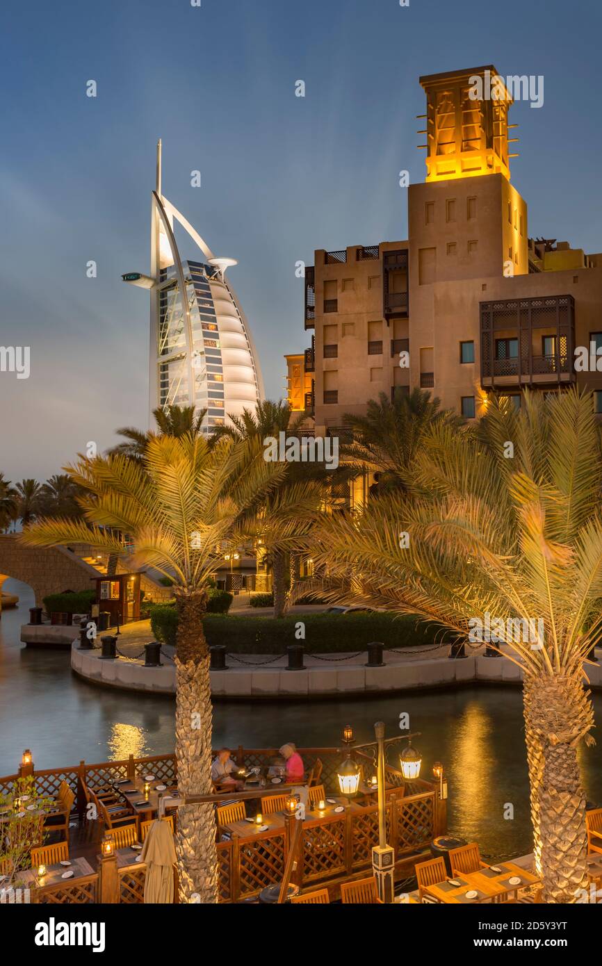 United Arab Emirates, Dubai, Burj al Arab Hotel and Souk Madinat at night Stock Photo