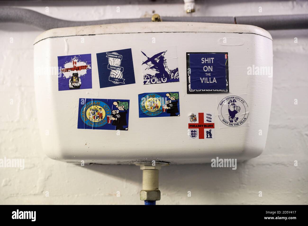Football stickers in the Gents toilet at Birmingham City Stock Photo
