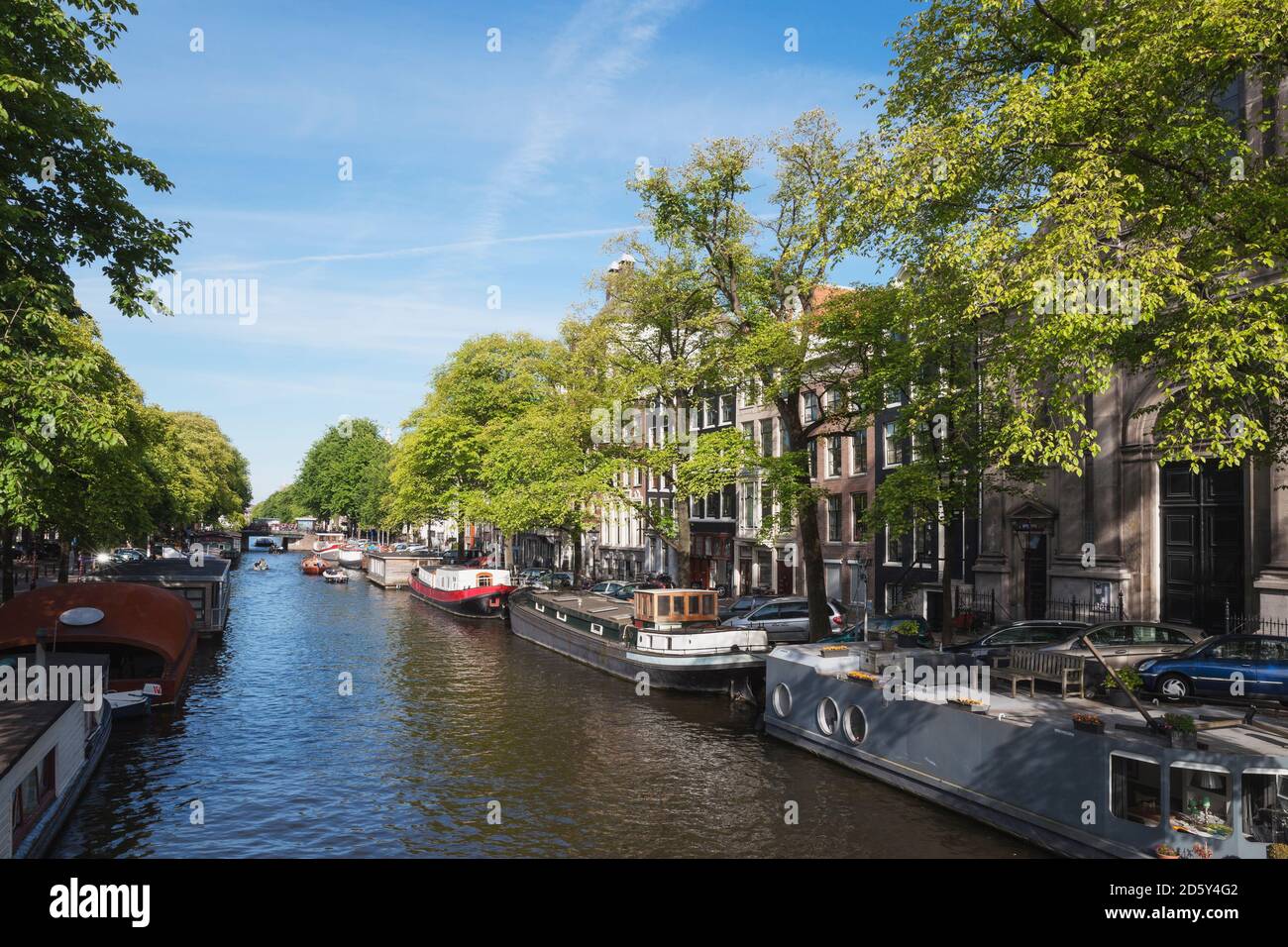 Netherlands, County of Holland, Amsterdam, town canal with house boats Stock Photo