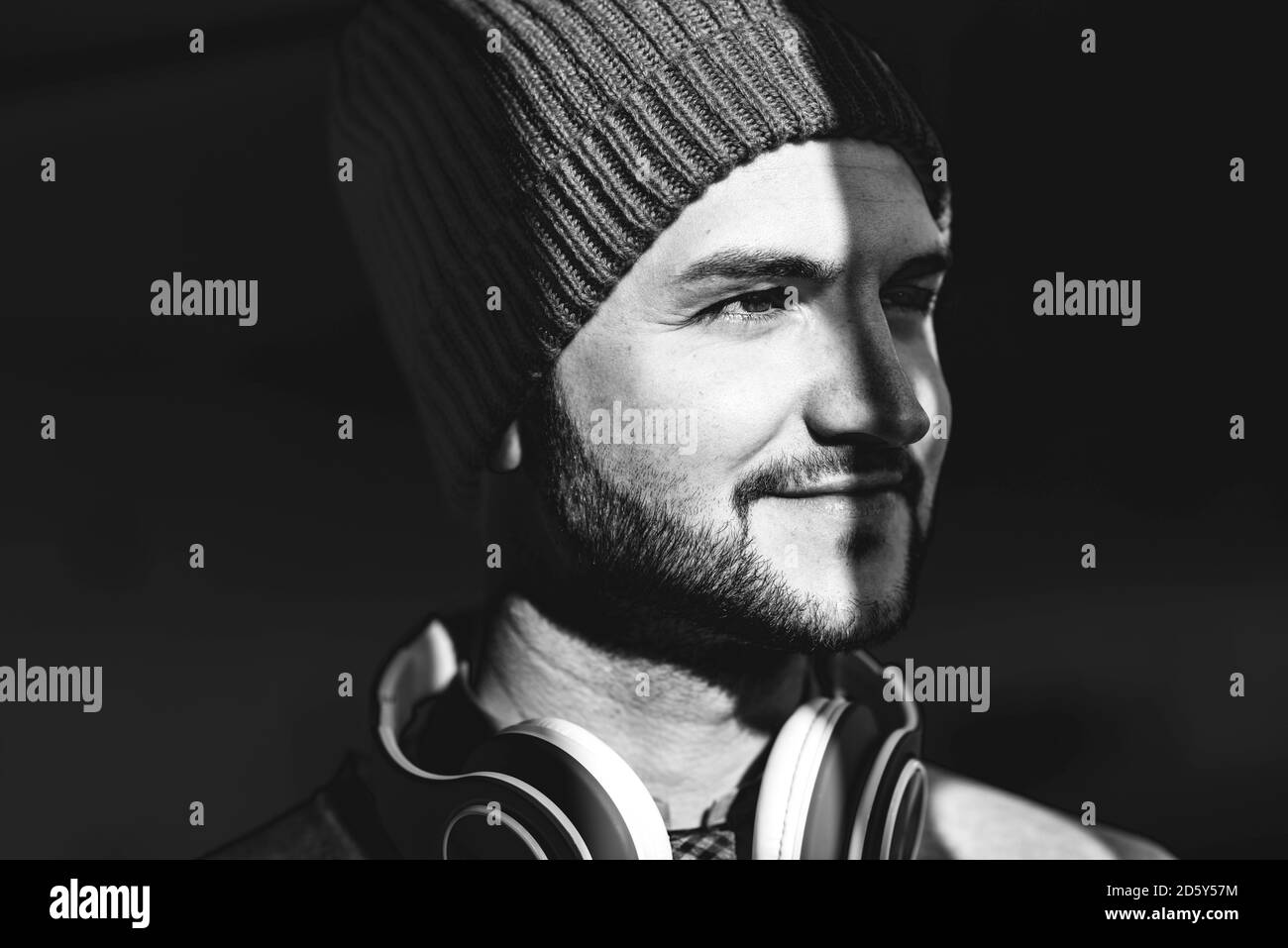 Smiling young man with wooly hat Stock Photo