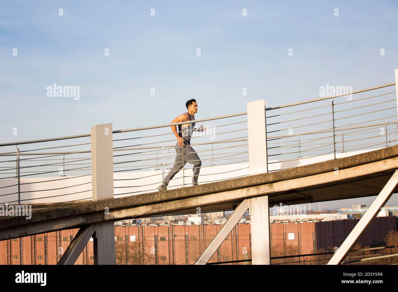 Man jogging upwards a ramp Stock Photo - Alamy