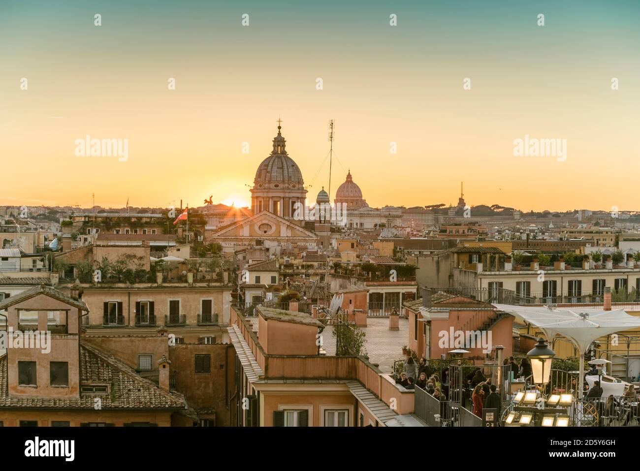 The skyline of Rome with San Carlo al Corso and St. Peter's Basilica before sunset seen from the Spanish Steps, Italy Stock Photo