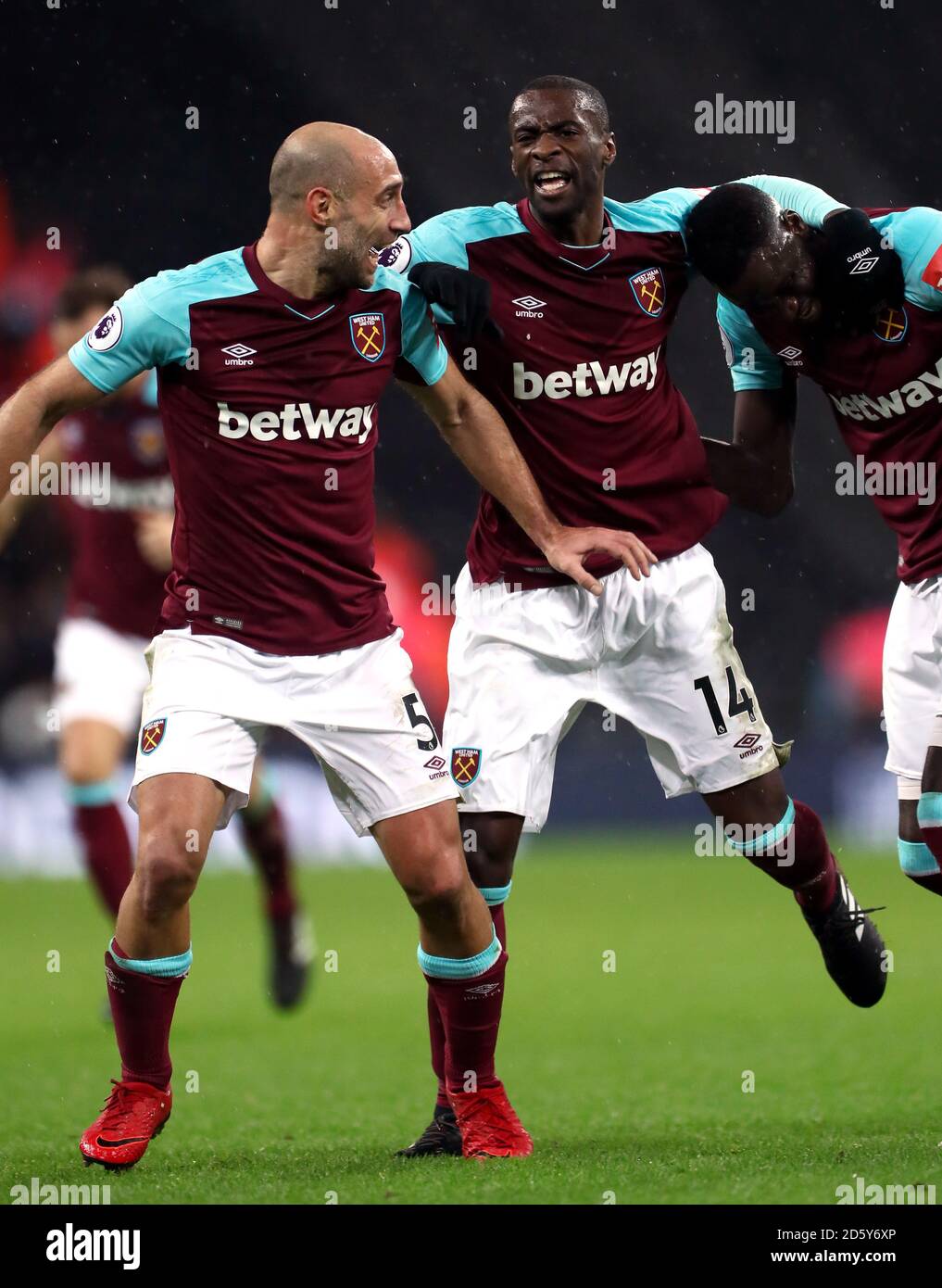 West Ham United's Pedro Obiang celebrates scoring his side's first goal of the game with Pablo Zabaleta (left) and Cheikhou Kouyate (right) Stock Photo