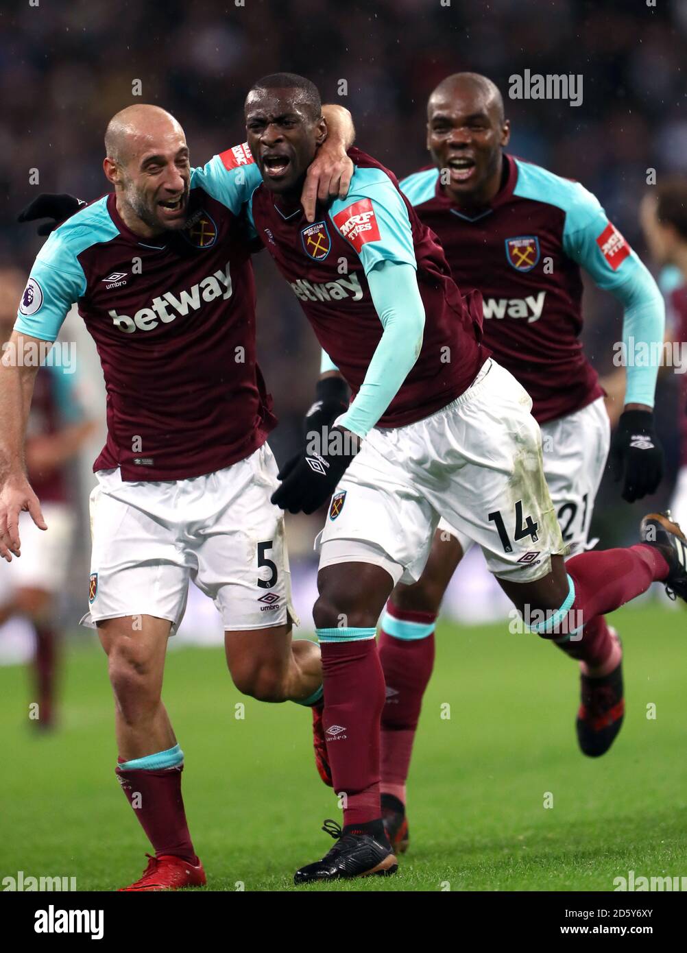 West Ham United's Pedro Obiang celebrates scoring his side's first goal of the game with Pablo Zabaleta (left) and Cheikhou Kouyate (right) Stock Photo