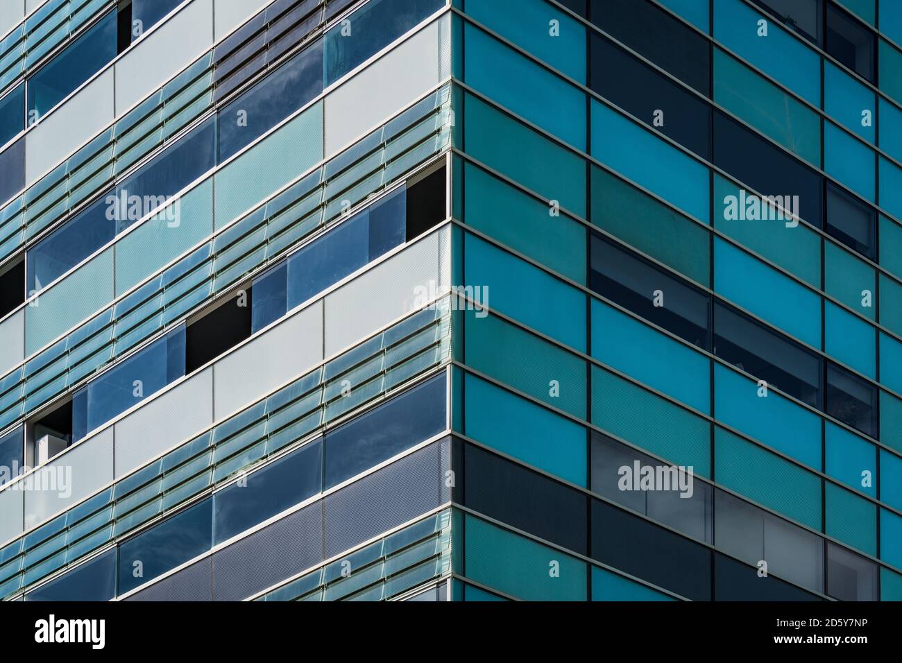Symmetrical view of the corner of a residential building with bluish ...