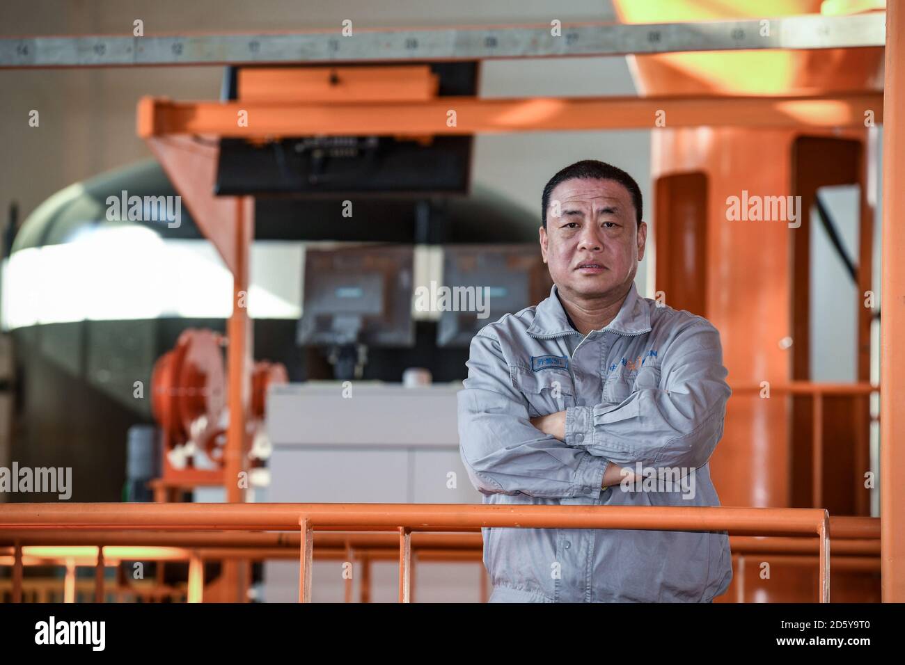 (201014) -- SHENZHEN, Oct. 14, 2020 (Xinhua) -- Qiao Sukai is seen at a training center in Shenzhen, south China's Guangdong Province, Nov. 20, 2019. Every 18 months, the Dayawan Nuclear Power Plant has to undergo a fuel assemblies replacement, which is one of the most important moments for the nuclear power plant. Dozens of engineers are divided into four shifts and operate the equipment day and night when the reactor is shut down. Their leader, Qiao Sukai, has been dealing with nuclear fuel since July 1993 when the nuclear fuel assembly of Dayawan Nuclear Power Plant arrived.    The professi Stock Photo