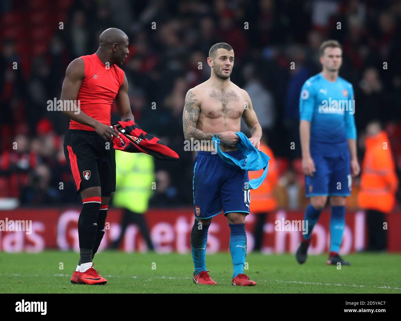 Arsenal's Jack Wilshere shows his dejection on the final whistle as he swaps shirts with AFC Bournemouth's Benik Afobe (left) Stock Photo