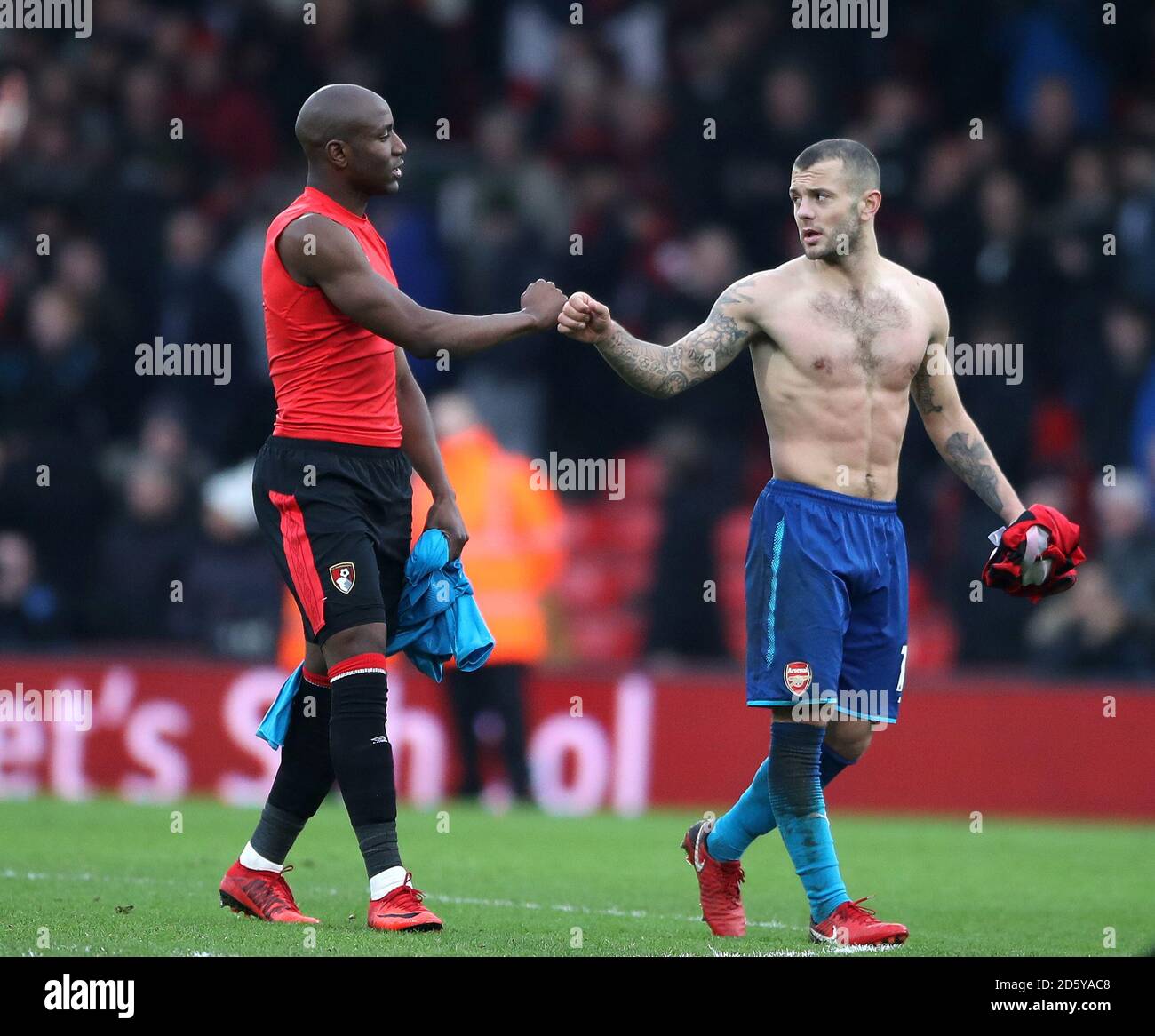 Arsenal's Jack Wilshere shows his dejection on the final whistle as he swaps shirts with AFC Bournemouth's Benik Afobe (Left) Stock Photo