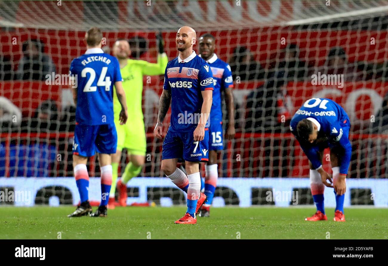 Stoke City's Stephen Ireland (left) and Stoke City's Eric Maxim Choupo-Moting appear dejected after Manchester United's Antonio Valencia (not in picture) scores his side's first goal of the game Stock Photo