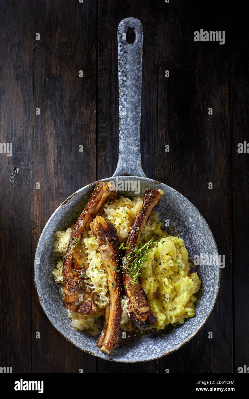 Spare ribs with sauerkraut and mashed potatoes in pan Stock Photo Alamy