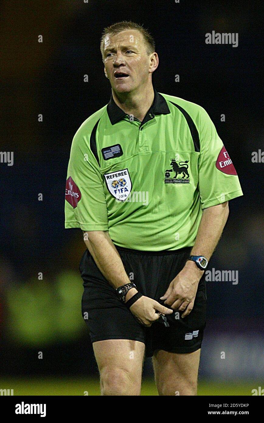 Referee Graham Poll readjusts himself during the game Stock Photo Alamy