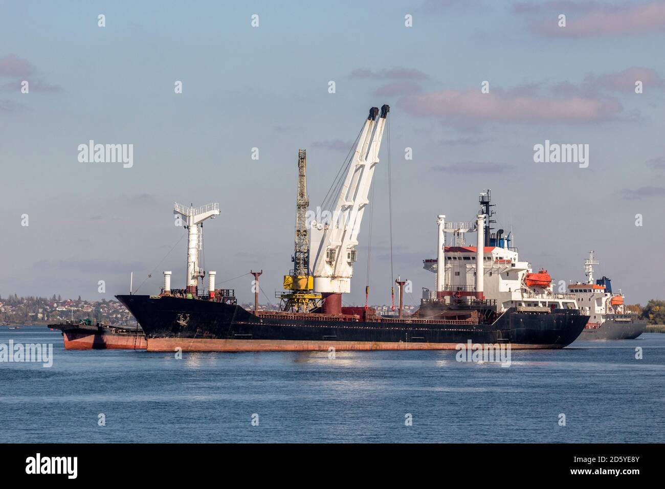 image of a large dry cargo ship on the roadstead of the Dnieper river Stock Photo