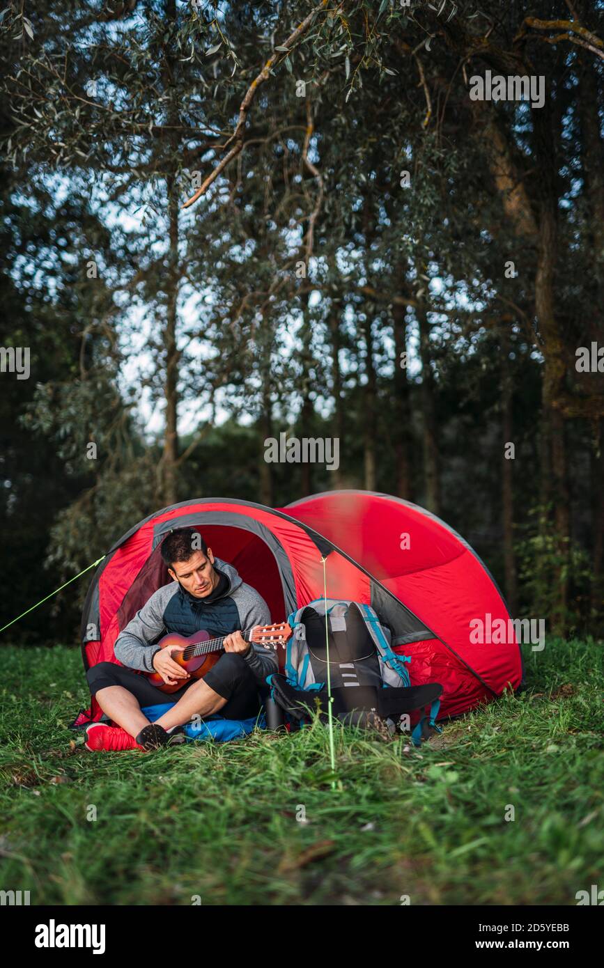 Camping man tent hi-res stock photography and images - Alamy