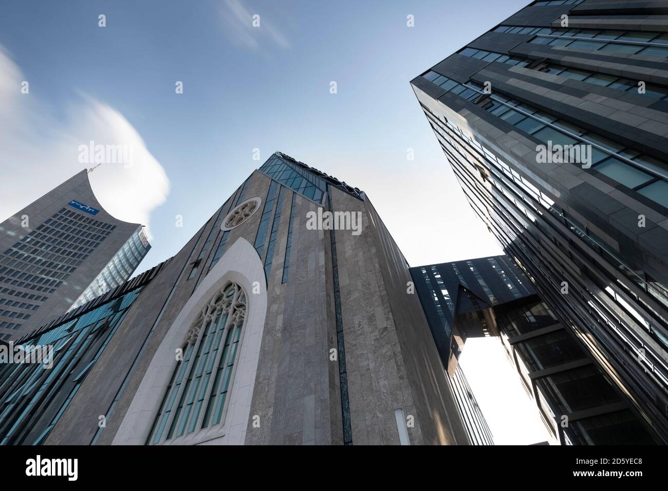 Germany, Leipzig, City-Hochhaus and university church seen from below Stock Photo