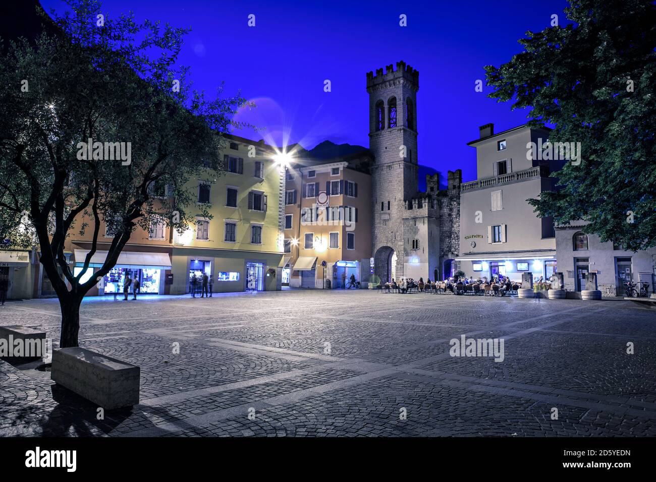 Italy, Riva del Garda, People sitting in restaurant, outdoors Stock Photo