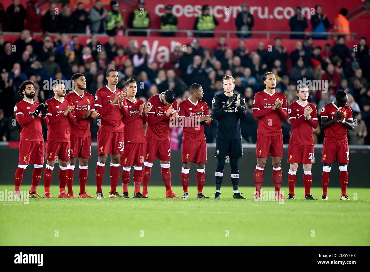Liverpool players line up on the pitch before the match begins Stock Photo - Alamy