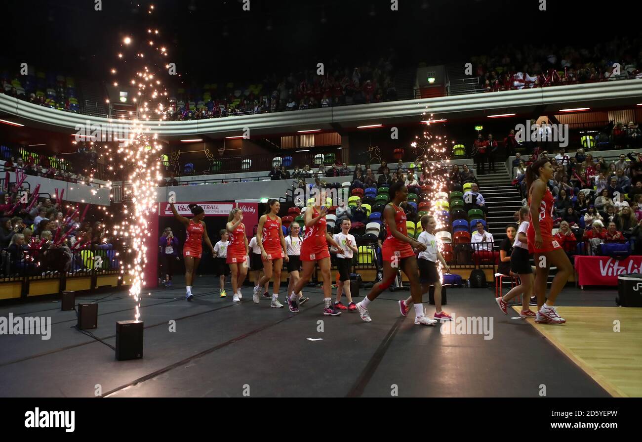 England Roses players head out onto the court ahead of the match Stock ...