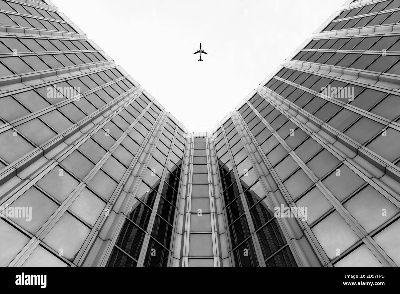Germany, Duesseldorf, view to plane and facades of high-rise buildings from below Stock Photo