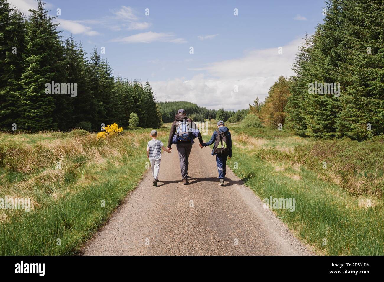 Group walking on country road hi-res stock photography and images - Alamy