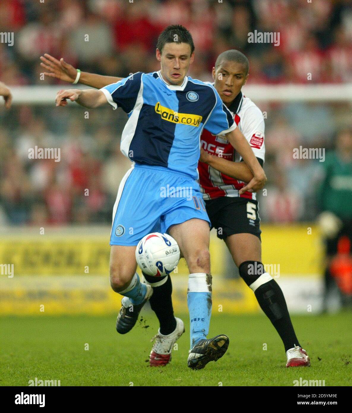 Wycombe Wanderers' Ian Stonebridge and Cheltenham Town's Gavin Caines. Stock Photo