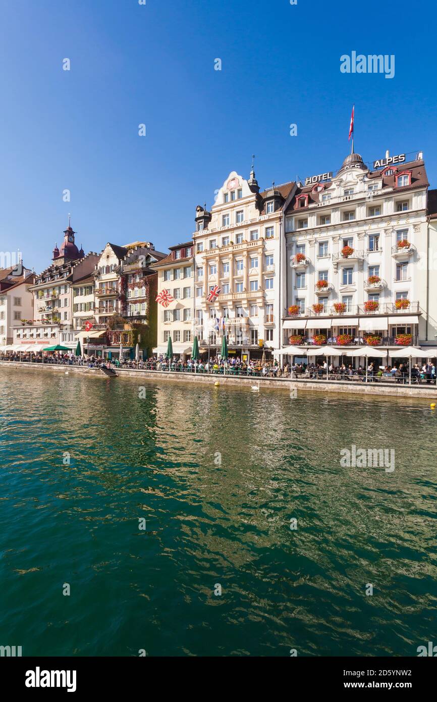 Switzerland, Luzern, row of houses and outdoor gastronomy at riverside of Reuss Stock Photo