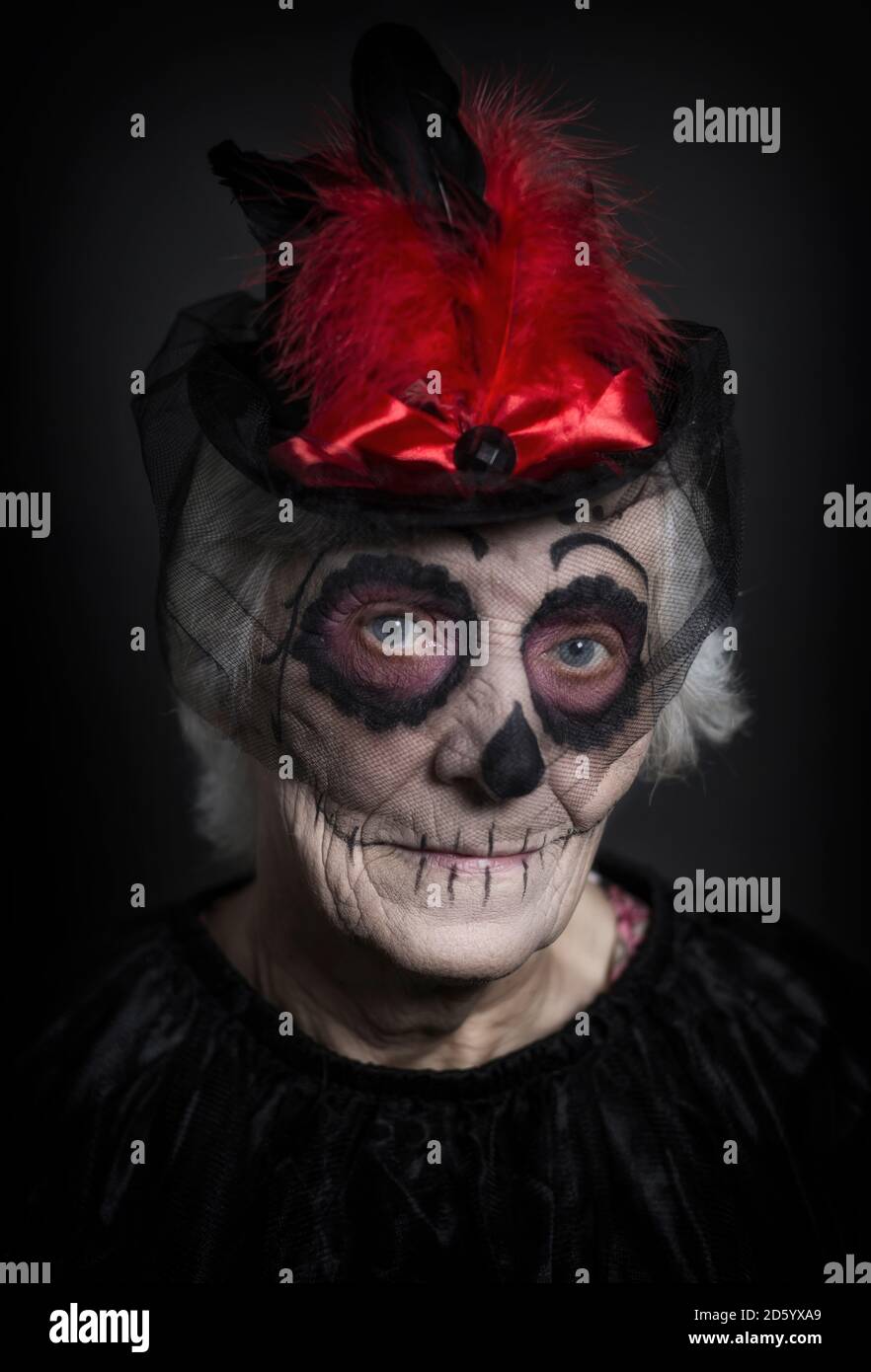 Senior woman with sugar skull make-up Stock Photo