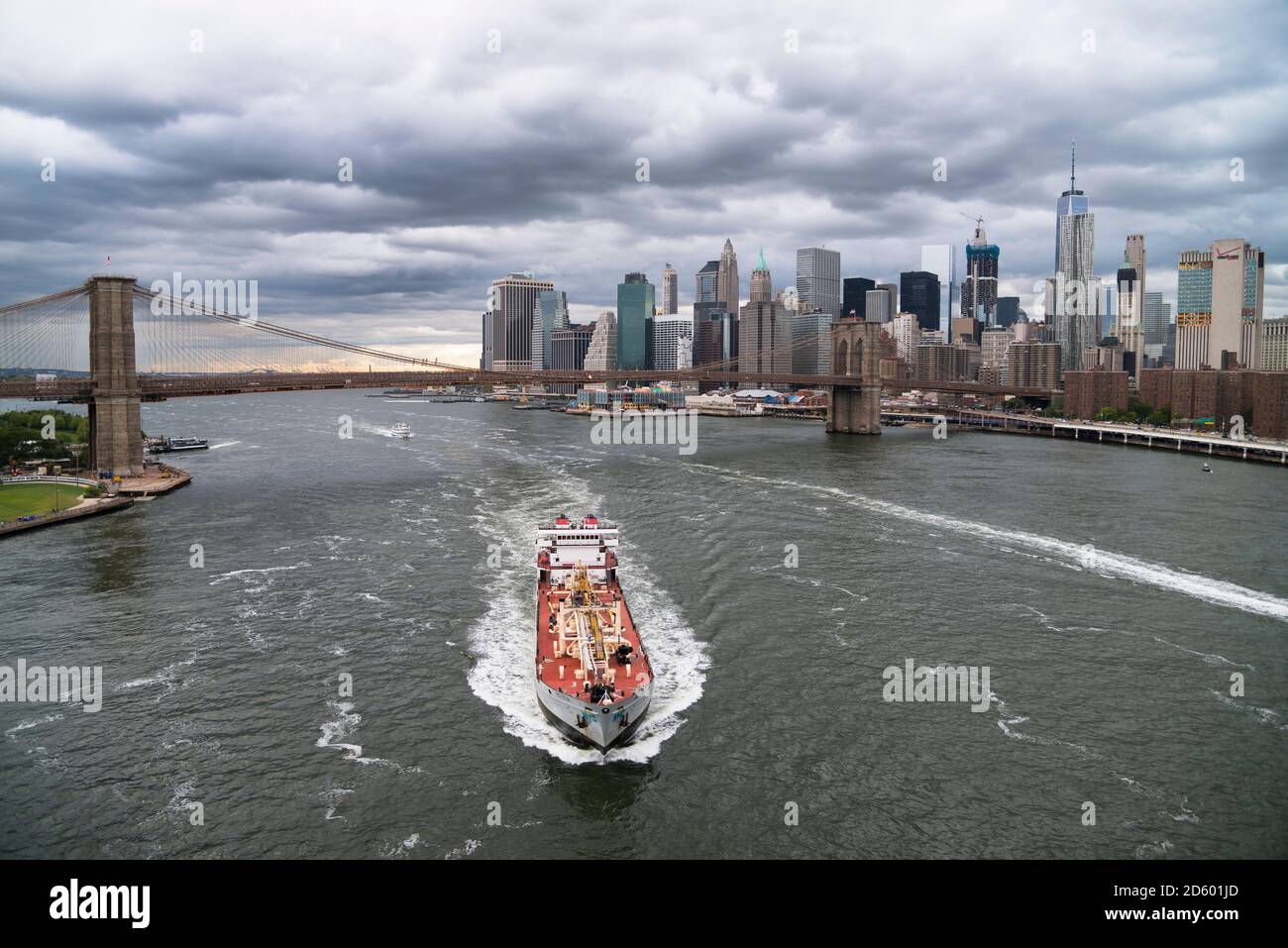 USA, New York City, ship on East River and Manhattan skyline Stock Photo