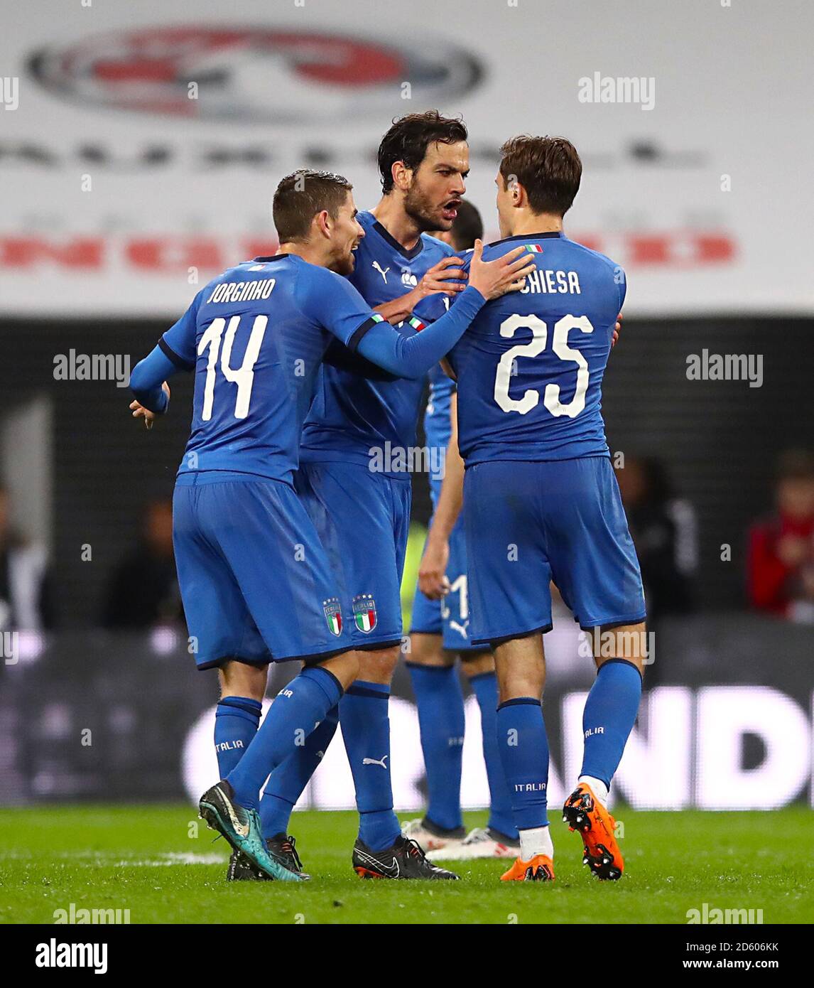 Italy's Marco Parolo (centre) exchanges words with Italy's Federico Chiesa as referee Deniz Aytekin (not pictured) reviews the VAR Stock Photo