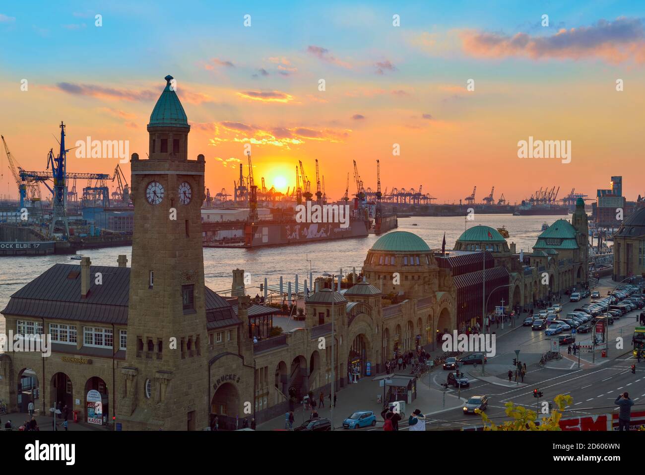 Germany, Hamburg, Port of Hamburg and Landungsbruecken at sunset Stock Photo
