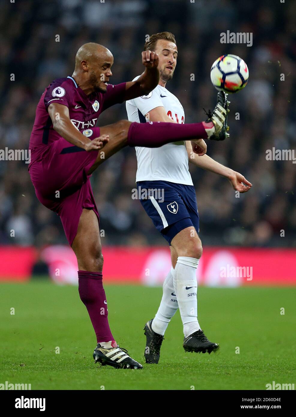 Manchester City's Vincent Kompany and Tottenham Hotspur's Harry Kane in action Stock Photo