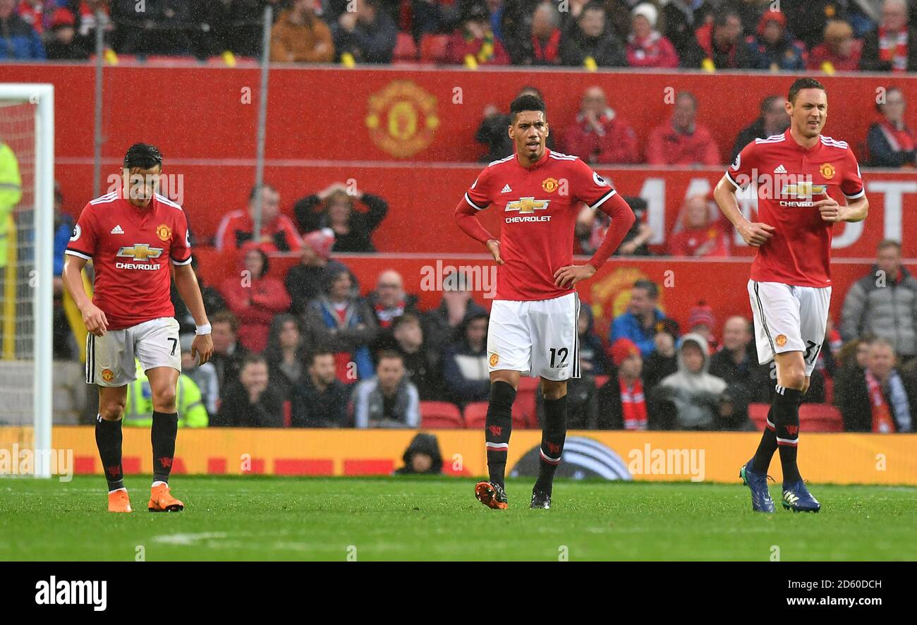 Manchester United's Chris Smalling (centre) with team-mates Alexis ...