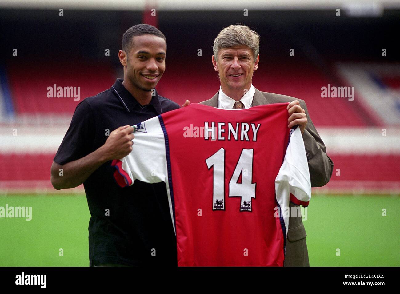 FILE PHOTO: Arsene Wenger is to leave Arsenal at the end of the season,  ending a near 22-year reign as manager Arsenal's Thierry Henry & his new  manager Arsene Wenger hold up