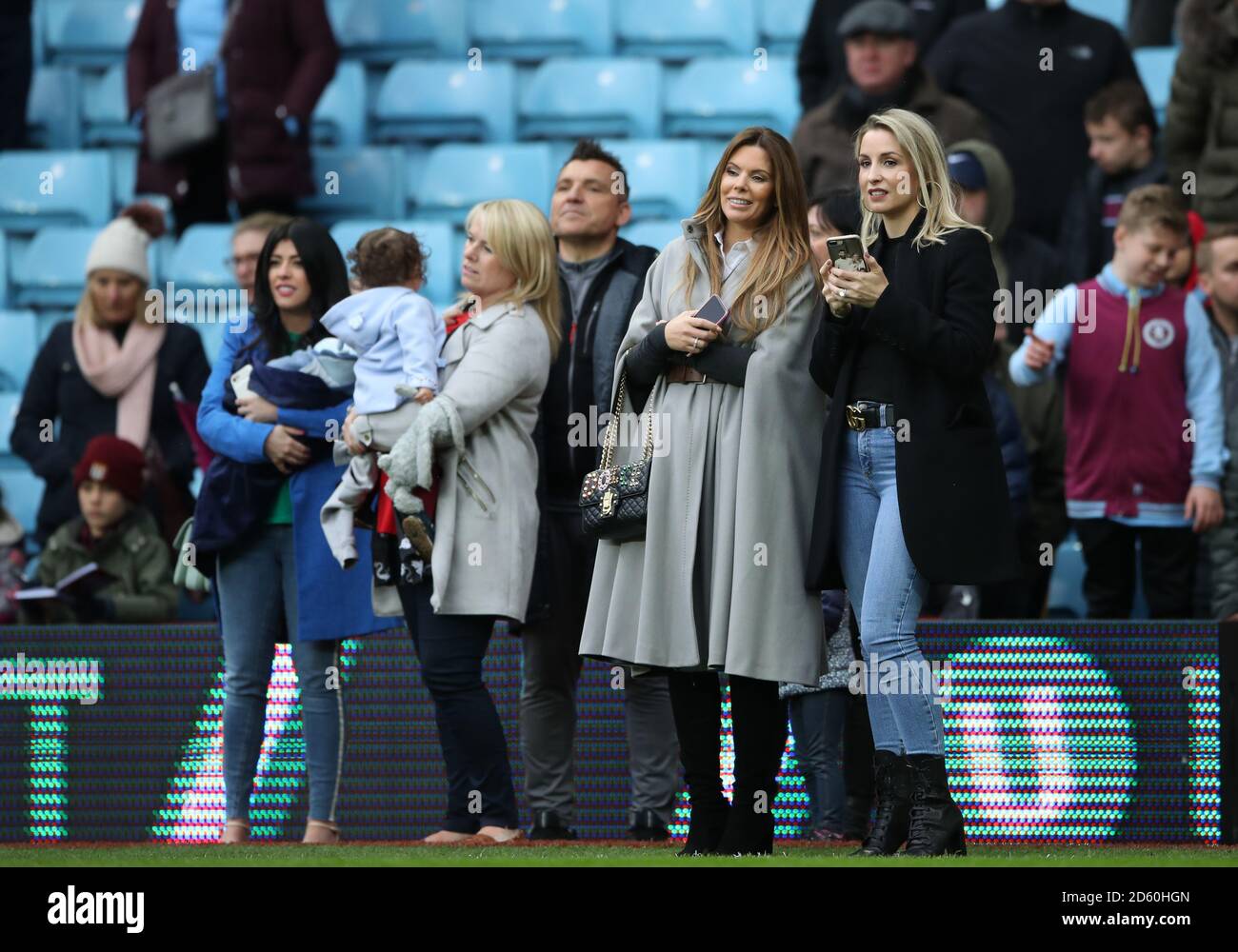 Toni Terry watches her husband Aston Villa's John Terry play football with their children after the game against Derby County Stock Photo